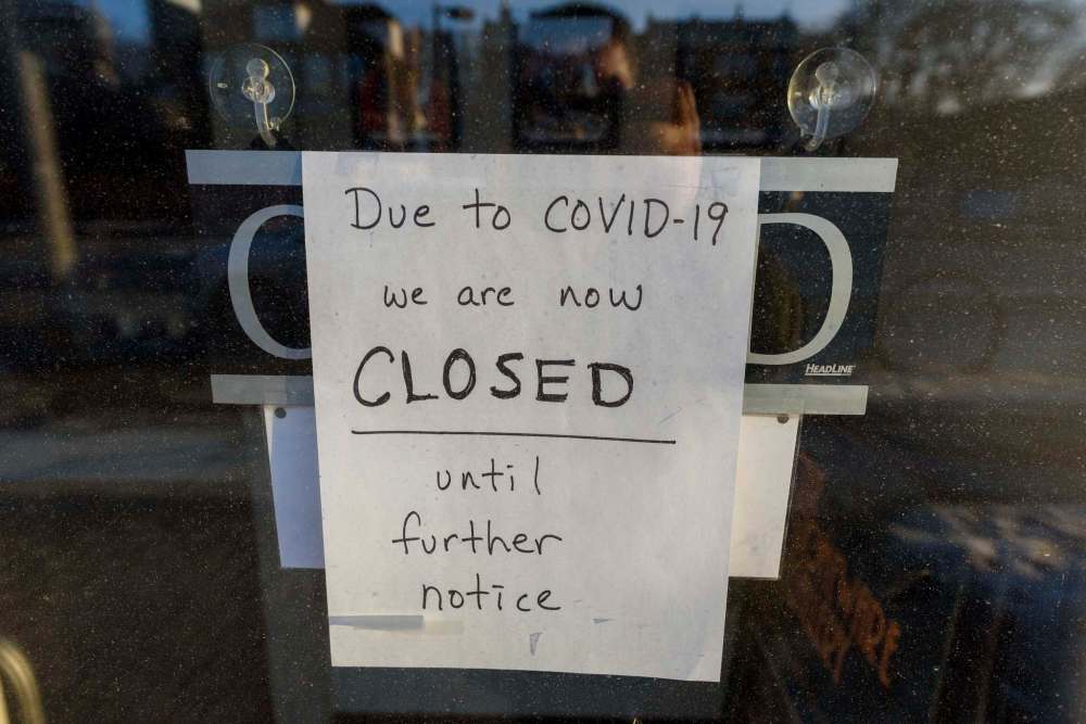 JESSE BOILY / WINNIPEG FREE PRESS The Stoneware Gallery, a pottery shop on Corydon, displays a sign of their closure due the COVID-19 outbreak on Monday, March 23, 2020. Reporter: