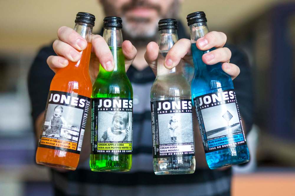 MIKAELA MACKENZIE / WINNIPEG FREE PRESS
Zelinsky displays four of the five labels of Jones Soda that feature his photographs.