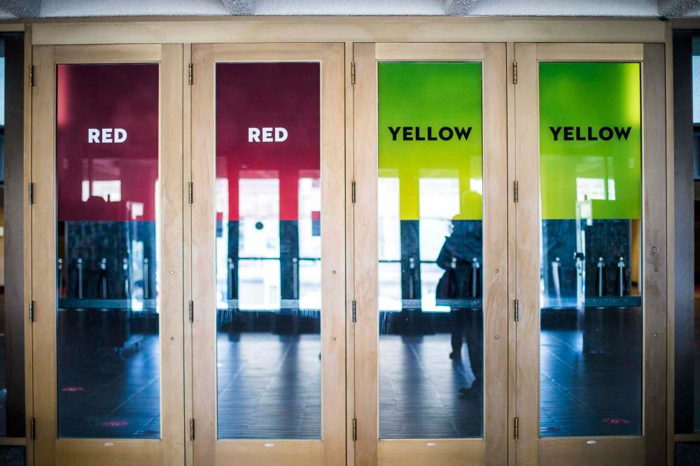 Colour-coded entrance doors will remain post-pandemic. (Mikaela MacKenzie / Winnipeg Free Press)
