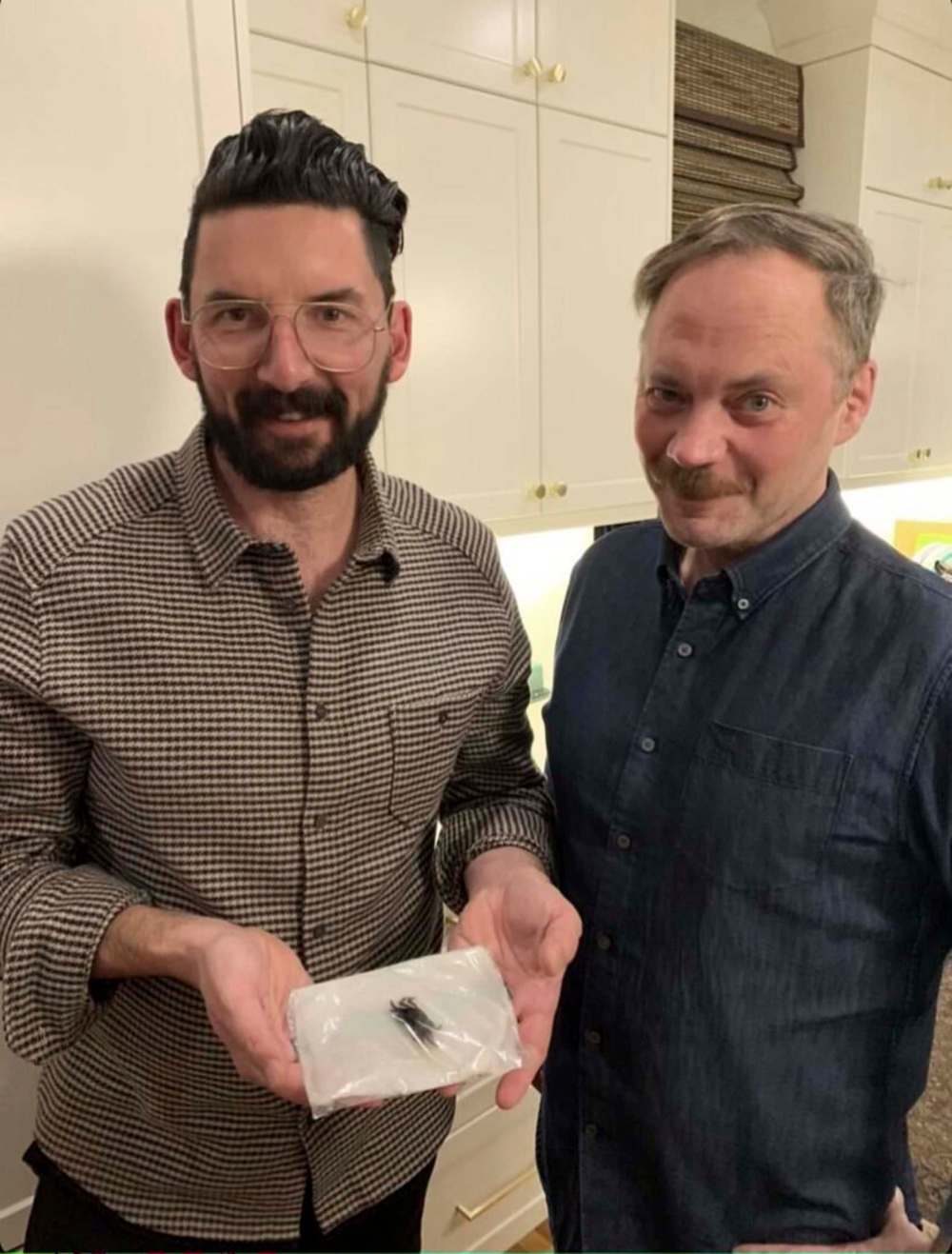 David Prichodko (left) was making a 50th birthday dinner for his partner, Alan Casey (right), when one of the creatures from a bag of mussels began to crawl. (Supplied)