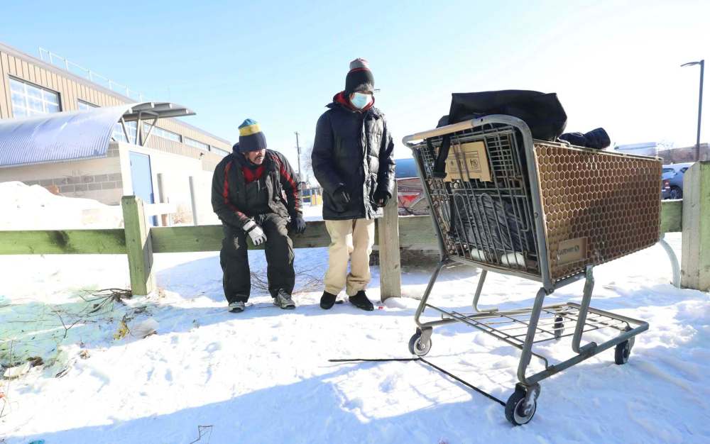 RUTH BONNEVILLE / WINNIPEG FREE PRESS
Winston Yellowback (right) and his friend Peter Blackhawk make their way back to Main Street Project shelter on Tuesday.