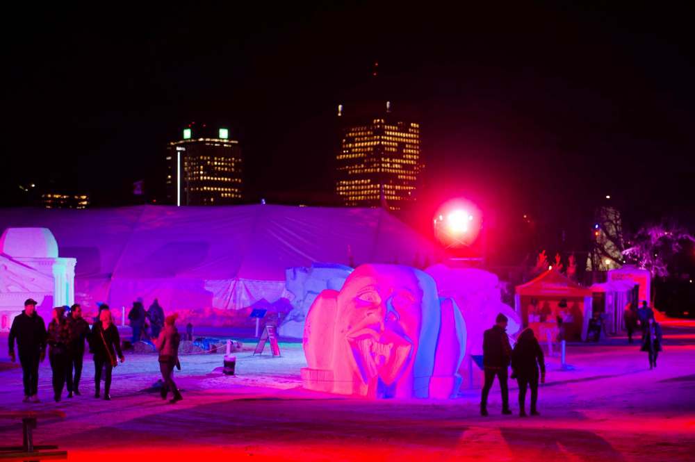 Mike Sudoma / Winnipeg Free Press
Festival Du Voyageur goers take in the Festival Du Voyaguer International Snow Sculpture Symposium Friday evening
February 16, 2020