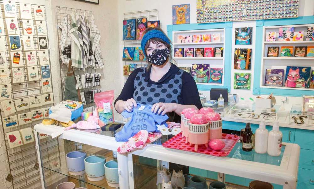 Tara Davis, owner of Tara Davis Studio Boutique, is one of several local business owners who have decided to hold off on a full reopening despite the restrictions on in-store shopping being lifted. She still offers curbside pickup and allows a limited number of customers at certain times. (Mike Deal / WInnipeg Free Press)