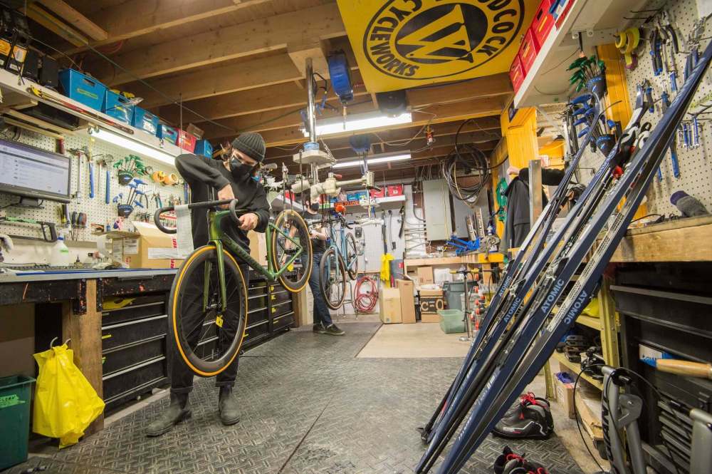 Woodcock Cycle Works tech, Charles Darroche, works on a custom-built bicycle for a customer Friday afternoon. (Mike Sudoma / Winnipeg Free Press)
