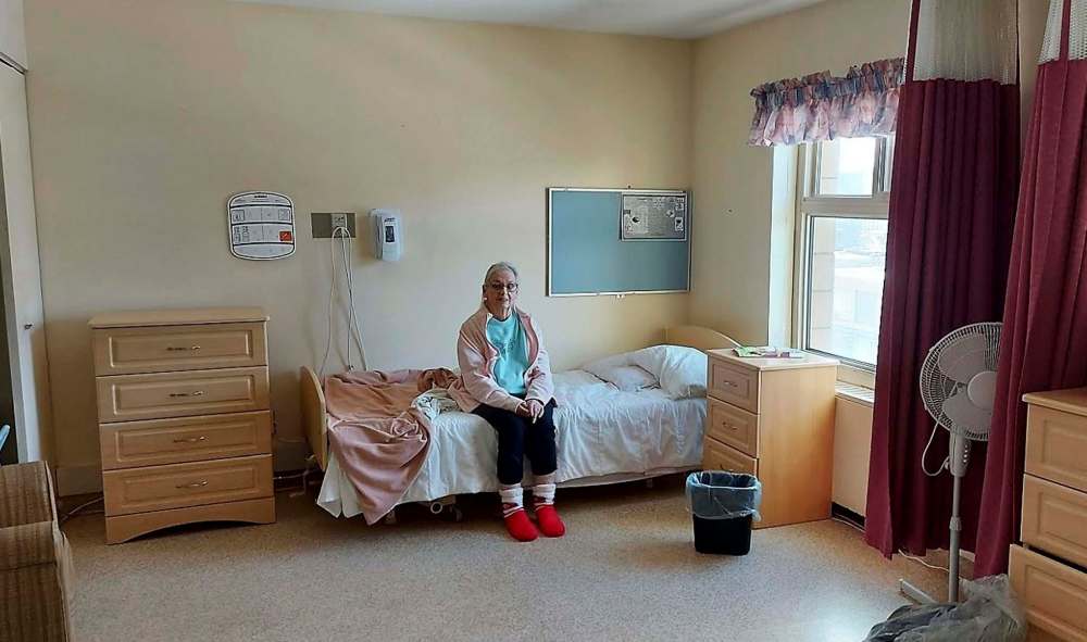 JOHN DOBBIN PHOTO
John Dobbin's mother sits in her new residence at Beacon Hill Lodge shortly after arriving in January.