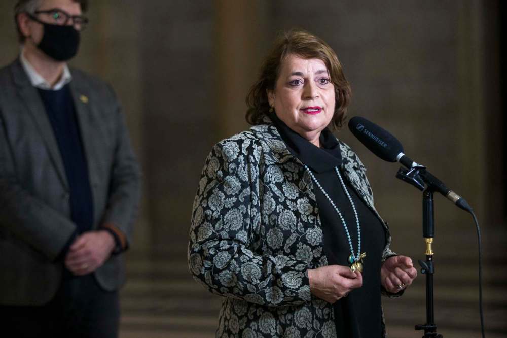 Eddie Calisto-Tavares, whose father passed away in the Maples Care Home from COVID-19, and Manitoba Liberal leader Dougald Lamont speak following the release of an external review about the COVID-19 outbreak at Maples Care Home. (Mikaela MacKenzie / Winnipeg Free Press)