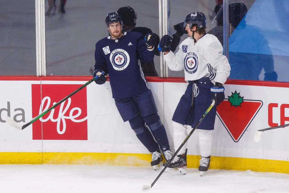 MIKE DEAL / WINNIPEG FREE PRESS
Dubois (left), the third-overall pick in the 2016 NHL draft, has 66 goals, 93 assists and 159 points in his first 239 NHL games. Mark Scheifele (right), the seventh-overall pick in the 2011 NHL draft, had 64 goals, 93 assists and 157 points in his first 239 NHL games.