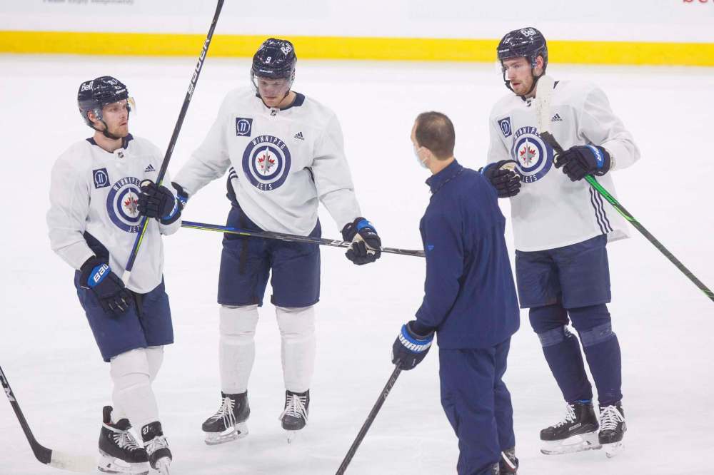 MIKE DEAL / WINNIPEG FREE PRESS
Nikolaj Ehlers, Andrew Copp, and Pierre-Luc Dubois talk with associate coach Jamie Kompon during practice Monday morning.