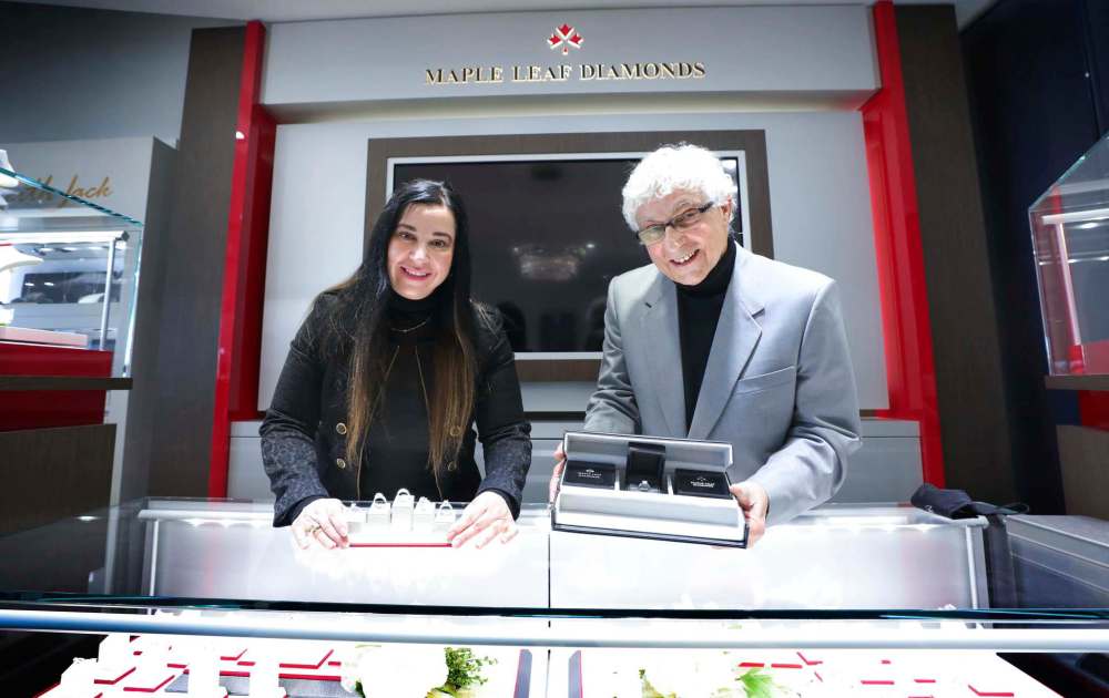 Joe Nemeth and and his daughter Michelle show off a selection of diamond rings at Nemeth Diamonds. Engagement rings have been selling well this year at the shop. (Ruth Bonneville / Winnipeg Free Press)
