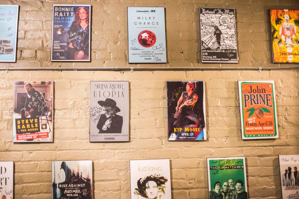 Signed posters from past shows in the green room. (Mikaela MacKenzie / Winnipeg Free Press)
