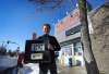 Ed Cantor, owner of Cantor’s Quality Meats and Groceries, outside his Logan Avenue store with a brick from the first location of the family business started by his grandfather. (Ruth Bonneville / Winnipeg Free Press)