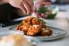 MIKAELA MACKENZIE / WINNIPEG FREE PRESS
Chef Mark Merano plates Korean fried chicken at home in Winnipeg on Monday, March 29, 2021. For Eva Wasney story.
Winnipeg Free Press 2021