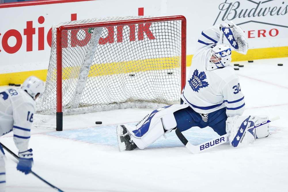 John Woods
/ The Canadian Press
Toronto Maple Leafs goaltender Michael Hutchinson (30) warms up prior to first period NHL action against the Winnipeg Jets, in Winnipeg, Wednesday, March 31, 2021.