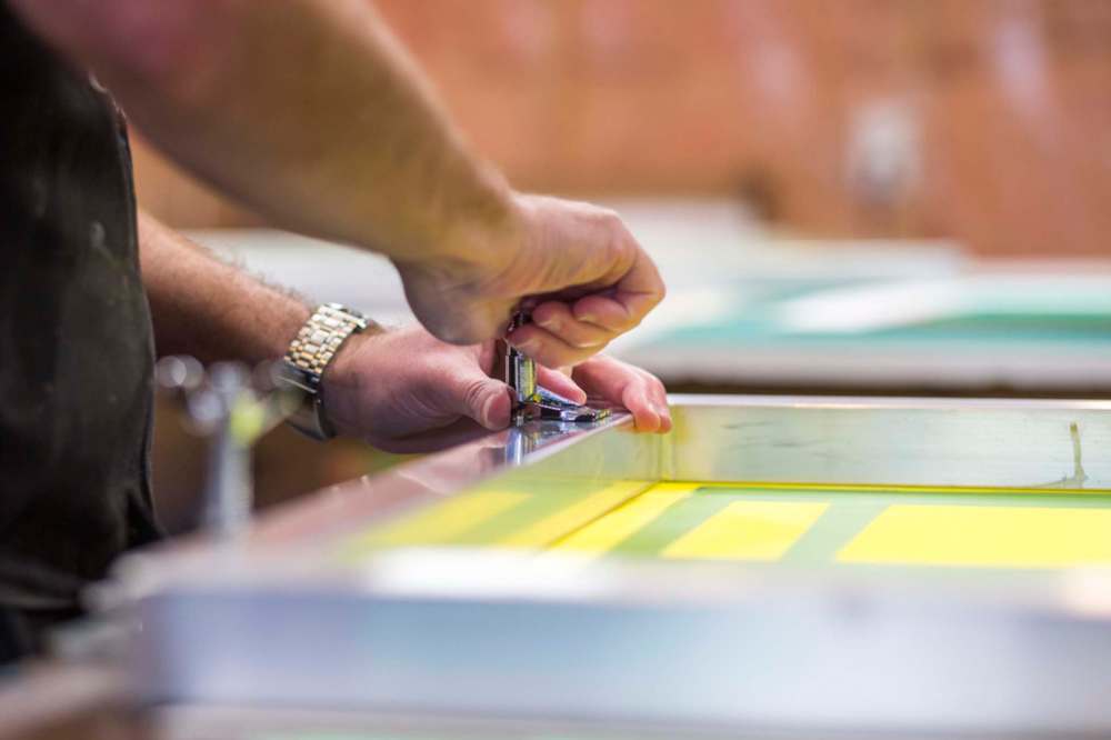 MIKAELA MACKENZIE / WINNIPEG FREE PRESS
The screen-printing process is a stencil method in which a design is imposed on a fine mesh screen.