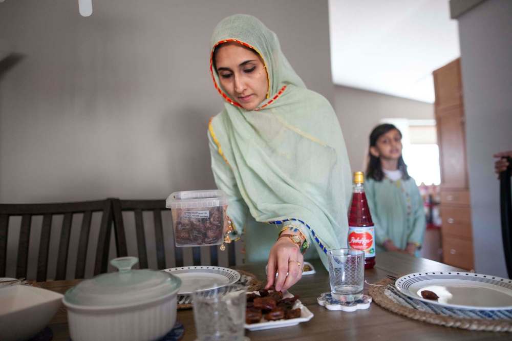 Daniel Crump / Winnipeg Free Press
Waleed sets out dates on the table. Each evening when the sun sets the family will break their ramadan fast by first eating a date.