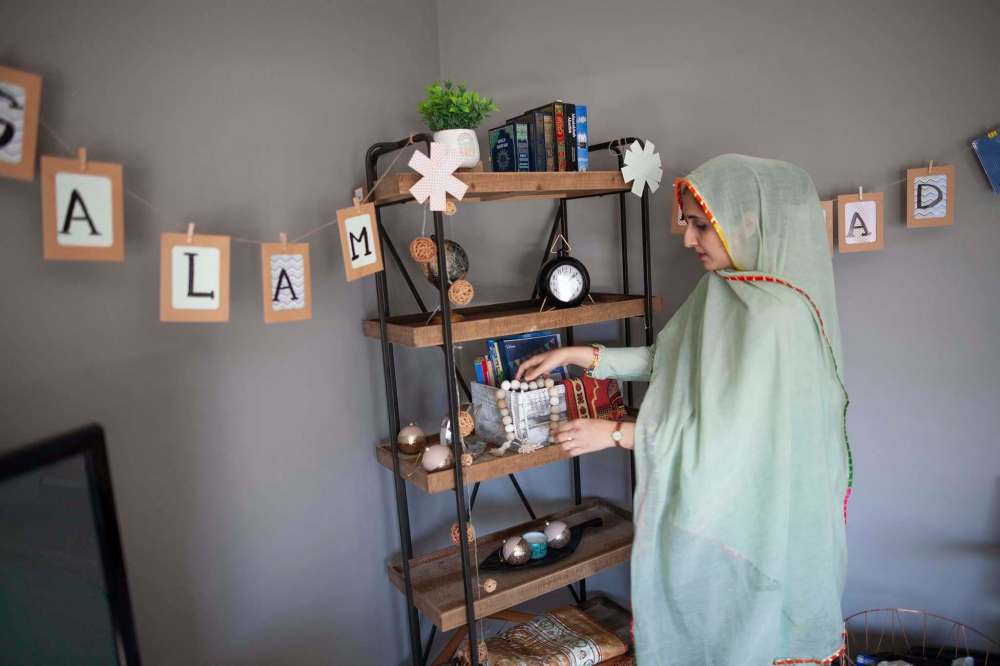 Daniel Crump / Winnipeg Free Press
Waleed adjusts the ramadan corner her family setup in their home.