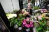 RUTH BONNEVILLE / WINNIPEG FREE PRESS Biz - Norwood Florist Photo of Michele Pitre, owner of Norwood Florist Design Studio, scene through the doors of her fridge full of beautiful flowers as she puts together a bouquet for a customer on Tuesday. Subject: Story on pandemic supply chain issues that florists are facing heading into Mothers' Day, the busiest week of the year for the industry. Business has been up by 30 per cent during the past year because people are sending more flowers since they can't meet in person. But Pitre at Norwood Florists asks customers to be patient because sometimes she doesn't even know what she's getting form the wholesalers April 27, 2021