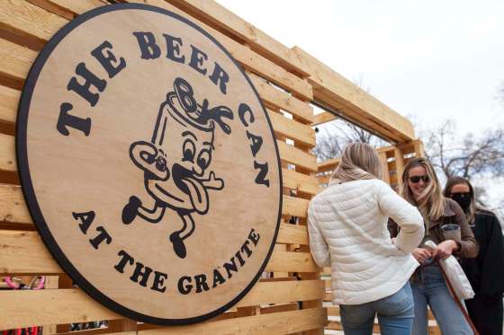 Patrons eagerly wait to enter The Beer Can and bask in the warm weather. (Daniel Crump / Winnipeg Free Press)