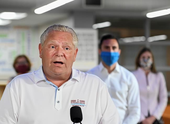 Ontario Premier Doug Ford makes an announcement regarding the governments plan for a safe reopening of schools in the fall due to the COVID-19 pandemic at Father Leo J Austin Catholic Secondary School in Whitby, Ont., on Thursday, July 30, 2020. THE CANADIAN PRESS/Nathan Denette