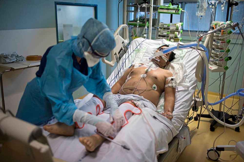 (AP Photo/Daniel Cole)
A nurse tends to a COVID-19 patient in the intensive care unit at the Joseph Imbert Hospital Center in Arles, southern France, Wednesday, Oct. 28, 2020. Many French doctors are urging a new nationwide lockdown, noting that 58% of the country's intensive care units are now occupied by COVID patients and medical staff are under increasing strain. (AP Photo/Daniel Cole)