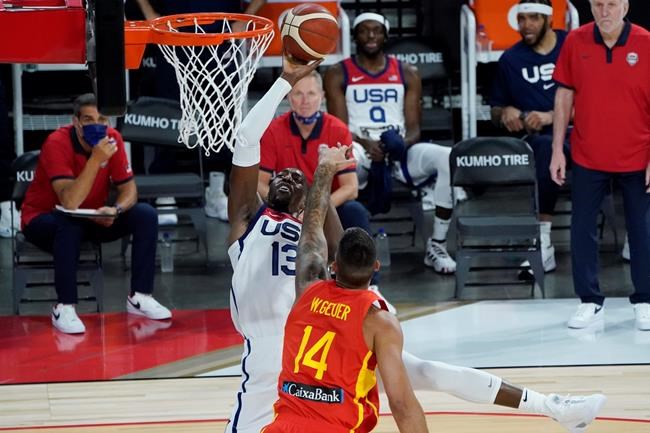 United States' Bam Adebayo (13) shoots against Spain's Willy Hernangomez (14) during the first half of an exhibition basketball game in preparation for the Olympics, Sunday, July 18, 2021, in Las Vegas. (AP Photo/John Locher)