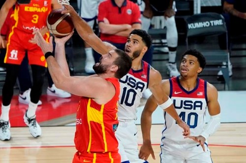 Spain's Marc Gasol (13) shoots around United States' Jayson Tatum (10) during the second half of an exhibition basketball game in preparation for the Olympics, Sunday, July 18, 2021, in Las Vegas. (AP Photo/John Locher)