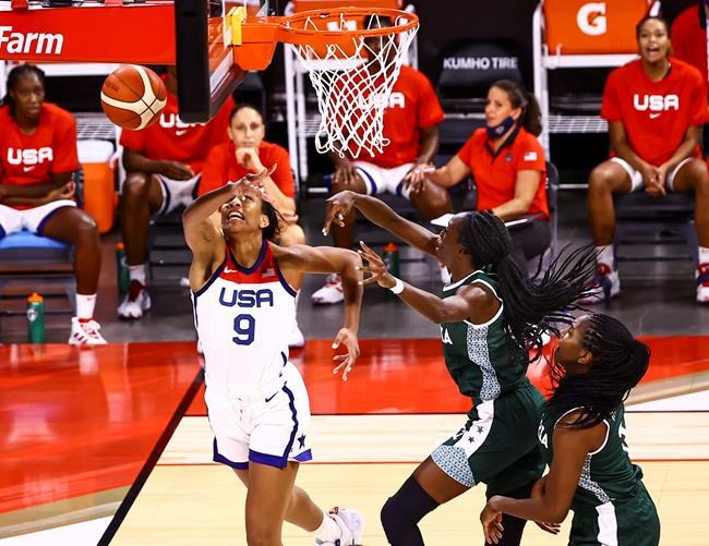 Nigeria guard Ifunanya Ibekwe, center right, blocks a shot from United States forward A'Ja Wilson (9) during the first half of a pre-Olympic exhibition basketball game in Las Vegas on Sunday, July 18, 2021. (Chase Stevens/Las Vegas Review-Journal via AP)
