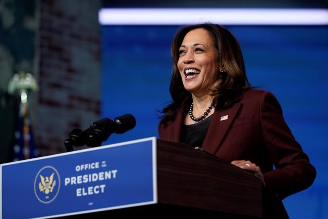 FILE - In this Tuesday, Nov. 24, 2020 file photo, Vice President-elect Kamala Harris speaks as she and President-elect Joe Biden introduce their nominees and appointees to key national security and foreign policy posts at The Queen theater, in Wilmington, Del. Vice President-elect Kamala Harris will be sworn in by Justice Sonia Sotomayor on Wednesday, Jan. 20, 2021, a history-making event in which the first Black, South Asian and female vice president will take her oath of office from the first Latina justice. (AP Photo/Carolyn Kaster, File)