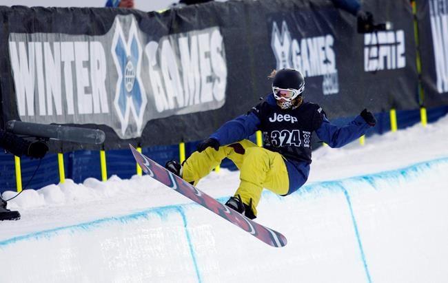 FILE - Elena Hight of South Lake Tahoe, Calif., competes during the snowboard superpipe women's elimination round during the Winter X Games at Buttermilk Mountain outside Aspen, Colo., in this Thursday, Jan. 28, 2010, file photo. The 2021 version of the Winter X Games promises lots of flipping and spinning, not so much singing and dancing. ESPN announced Tuesday, Dec. 15, 2020, that the first major action-sports contest since the COVID pandemic started forcing major cancellations will take place during its usual slot in Aspen during the last weekend of January, the 29th-31st, but will be closed off to fans. (AP Photo/David Zalubowski, File)