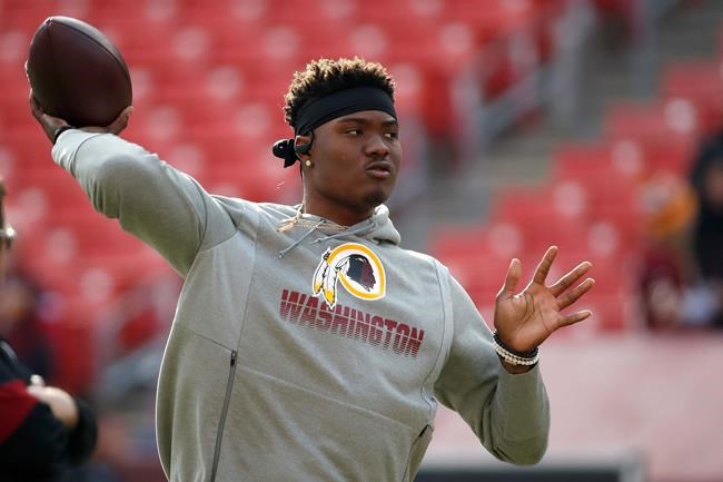 FILE - In this Dec. 22, 2019, file photo, Washington Redskins quarterback Dwayne Haskins works out prior to an NFL football game against the New York Giants, in Landover, Md. A new name must still be selected for the Washington Redskins football team, one of the oldest and most storied teams in the National Football League, and it was unclear how soon that will happen. But for now, arguably the most polarizing name in North American professional sports is gone at a time of reckoning over racial injustice, iconography and racism in the U.S. (AP Photo/Alex Brandon, File)