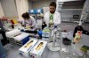 FILE - In this May 24, 2016, file photo, lab technicians work at Russia's national drug-testing laboratory in Moscow, Russia. The Russians were running out of time. Experts from the World Anti-Doping Agency were heading to Moscow to finally receive the trove of data they‚Äôd been seeking for two years. Instead of getting ready to hand it over, Russian authorities stayed busy in a round-the-clock endeavor to keep changing, deleting and manipulating the data. Granular details of the plot are sprinkled throughout WADA‚Äôs previously confidential 89-page report, obtained by The Associated Press. Among the most brazen projects, the report says, was the rewriting of memos to make it look as though the man who exposed the plot was leveraging the Russian doping scheme to line his own pockets. (AP Photo/Alexander Zemlianichenko, File)