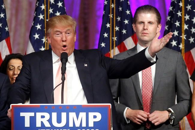 FILE - In this Tuesday, March 15, 2016 file photo, Republican presidential candidate Donald Trump speaks to supporters at his primary election night event at his Mar-a-Lago Club in Palm Beach, Fla. At right is his son Eric Trump. New York City is looking to terminate its contracts with Trump to run two Central Park skating rinks and other facilities after a Trump-inspired mob rioted and breached the U.S. Capitol, Mayor Bill de Blasio said Tuesday, Jan. 12, 2021. (AP Photo/Gerald Herbert)