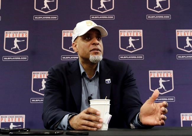FILE - In this Feb. 19, 2017, file photo, Major League Players Association Executive Director Tony Clark, answers questions at a news conference in Phoenix. Commissioner Rob Manfred says there might be no major league season after a breakdown in talks between teams and the union on how to split up money in a season delayed by the coronavirus pandemic. The league also said several players have tested positive for COVID-19. Two days after union head Clark declared additional negotiations futile, Deputy Commissioner Dan Halem sent a seven-page letter to players' association chief negotiator Bruce Meyer asking the union whether it will waive the threat of legal action and tell MLB to announce a spring training report date and a regular season schedule. (AP Photo/Morry Gash, File)