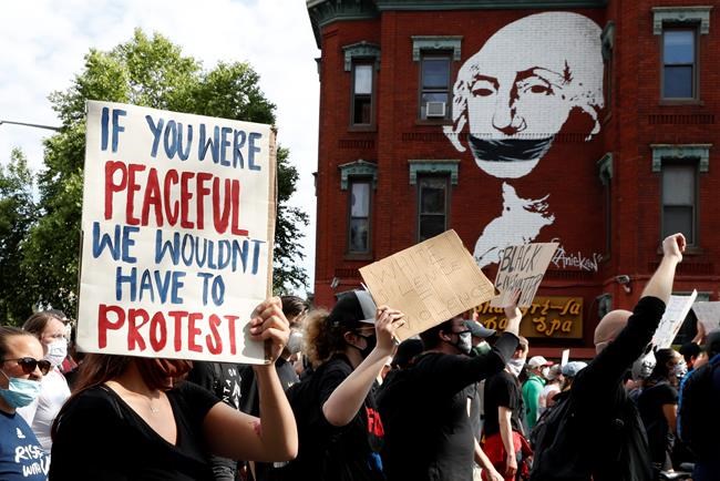 FILE - In this June 2, 2020, file photo, demonstrators march to protest the death of George Floyd in Washington. Floyd died after being restrained by Minneapolis police officers. (AP Photo/Jacquelyn Martin, File)