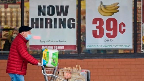 FILE - A man walks out of a Marc's Store, Friday, Jan. 8, 2021, in Mayfield Heights, Ohio. Fewer Americans applied for unemployment benefits last week, lowering claims to 900,000, still a historically high level that points to further job cuts in a raging pandemic. (AP Photo/Tony Dejak, file)