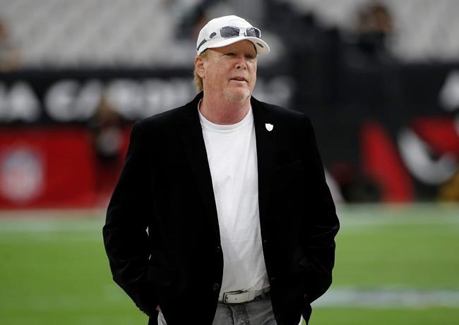 FILE - In this Aug. 15, 2019, file photo, Raiders owner Mark Clark Davis stands on the field before the team's NFL football game against the Arizona Cardinals in Glendale, Ariz. The Las Vegas Raiders got angry backlash for a tweet the team sent after Minneapolis police officer Derek Chauvin was convicted of murdering George Floyd. Davis said he was driving the verdict was announced and heard Floyd's brother, Philonise, make the statement that “we can all breathe again” and decided to make that message the team's response. (AP Photo/Rick Scuteri, File)