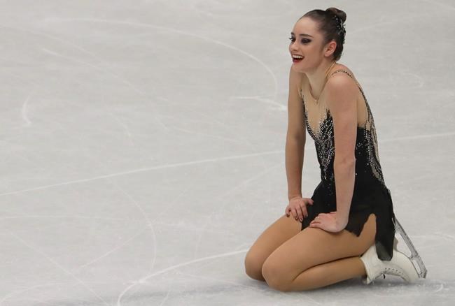 FILE- In this March 23, 2018, file photo, Kaetlyn Osmond, of Canada, reacts after completing her women's free skating program at the Figure Skating World Championships in Assago, near Milan, Italy. For the better part of two decades, Osmond knew exactly what she'd be doing every day. Her world revolved around figure skating. She retired last May and hasn't competed since winning gold at the 2018 world championships. And while she's at peace with her decision, the months since haven't been all that smooth. (AP Photo/Luca Bruno, File)