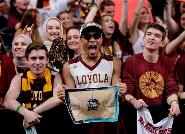 FILE - In this March 31, 2018, file photo, Loyola-Chicago fans cheer at the Final Four of the NCAA college basketball tournament in San Antonio. NCAA President Mark Emmert says NCAA Division I basketball tournament games will be played without fans in the arenas because of concerns about the spread of coronavirus. (AP Photo/Eric Gay, File)
