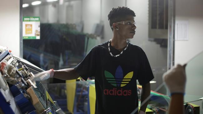 This image released by Netflix shows Zach Ray at work at the Fuyao Glass America factory in Dayton, Ohio, in a scene from the Oscar-nominated documentary