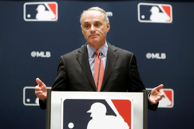 FILE - In this Nov. 21, 2019, file photo, baseball commissioner Rob Manfred speaks to the media at the owners meeting in Arlington, Texas. The chance that there will be no Major League Baseball season increased substantially Monday, June 15, 2020, when the commissioner's office told the players' association it will not proceed with a schedule amid the coronavirus pandemic unless the union waives its right to claim management violated a March agreement between the feuding sides. (AP Photo/LM Otero, File)