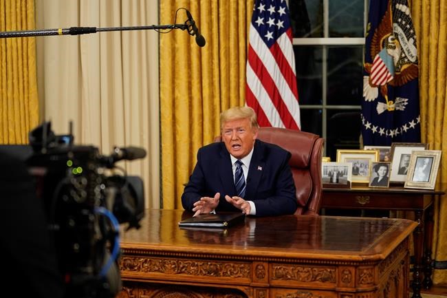 President Donald Trump speaks in an address to the nation from the Oval Office at the White House about the coronavirus Wednesday, March, 11, 2020, in Washington. (Doug Mills/The New York Times via AP, Pool)