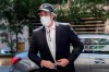 FILE- In this May 21, 2020 file photo, Michael Cohen arrives at his Manhattan apartment in New York after being furloughed from prison because of concerns over the coronavirus. A bound edition about President Donald Trump’s second impeachment will feature a foreword from an estranged associate _ former Trump attorney Michael Cohen. Skyhorse Publishing announced that “The Second Impeachment Report