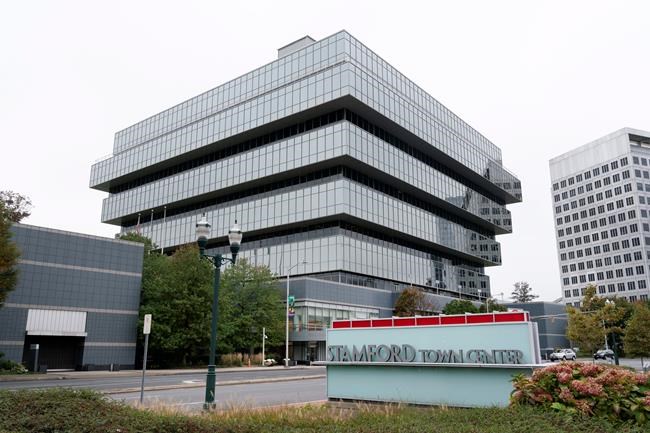 FILE- In this Wednesday, Oct. 21, 2020, file photo Purdue Pharma headquarters stands in Stamford, Conn. Proposed settlements between the federal government and OxyContin maker Purdue Pharma and its owners cleared a major legal hurdle Tuesday, Nov. 17, 2020, when a bankruptcy judge said they could move ahead. (AP Photo/Mark Lennihan, File)