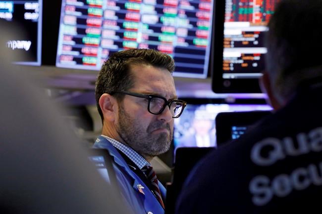 Trader Leon Montana works on the floor of the New York Stock Exchange, Friday, Feb. 28, 2020. Stocks are opening sharply lower on Wall Street, putting the market on track for its worst week since October 2008 during the global financial crisis. (AP Photo/Richard Drew)