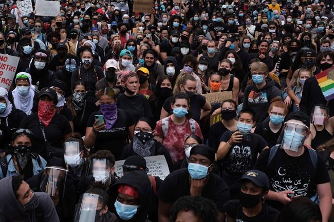 Protesters gather at Foley Square as part of a demonstration to protest the death of George Floyd, who died May 25 after he was pinned at the neck by a Minneapolis police officer., Tuesday, June 2, 2020, in New York. (AP Photo/Yuki Iwamura)