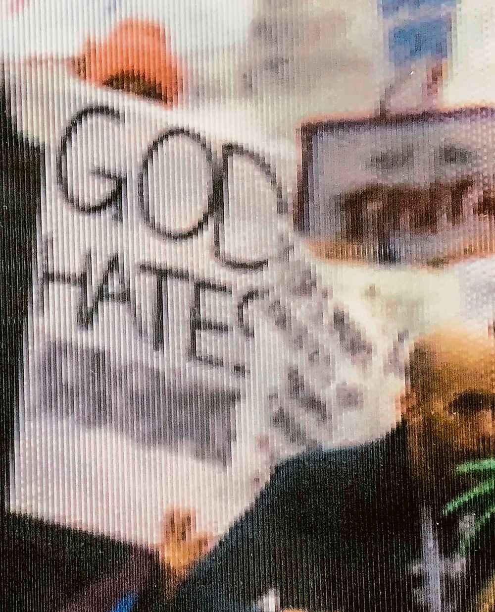 A close-up image shows the altered sign in a photo displayed at the National Archives in Washington, D.C. (Salwan Georges / Washington Post)