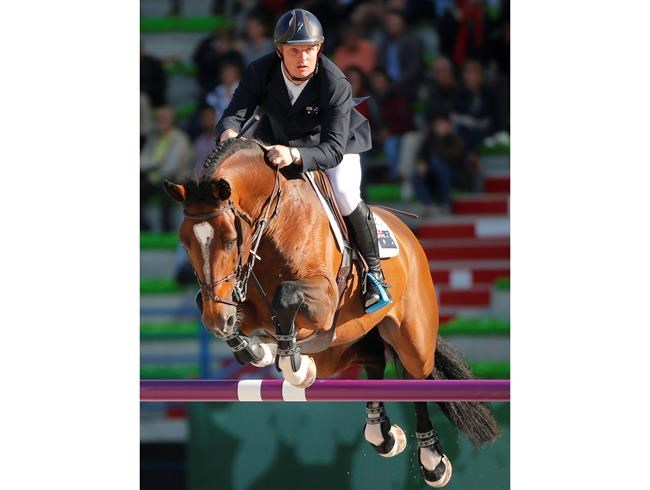 FILE - In this Sept. 3, 2014, file photo, Jamie Kermond of Australia, riding Quite Cassini competes during the second day of the team and individual qualifying show jumping event at the FEI World Equestrian Games in Caen, western France. Equestrian Australia said Wednesday, July 21, 2021, it had provisionally suspended Kermond, a member of the Olympic show jumping team over a positive test for cocaine. (AP Photo/Michel Euler, File)