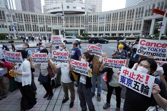 FILE - In this June 23, 2021, file photo, people protest against the July opening of the Tokyo 2020 Olympics near the Tokyo Metropolitan Government building in Tokyo. The Tokyo Olympics are going ahead despite opposition from many quarters inside Japan. The Japanese medical community is largely against it. (AP Photo/Eugene Hoshiko, File)