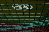 The Olympic rings painted on the field are seen through a net as U.S. softball players take batting practice at the Fukushima Azuma Baseball Stadium ahead of the 2020 Summer Olympics, Tuesday, July 20, 2021, in Fukushima, Japan. (AP Photo/Jae C. Hong)