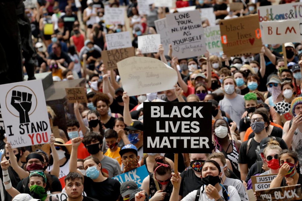 A Kansas City, Mo. rally to protest the death of George Floyd who died after being restrained by Minneapolis police officers on May 25. (AP Photo/Charlie Riedel, File)